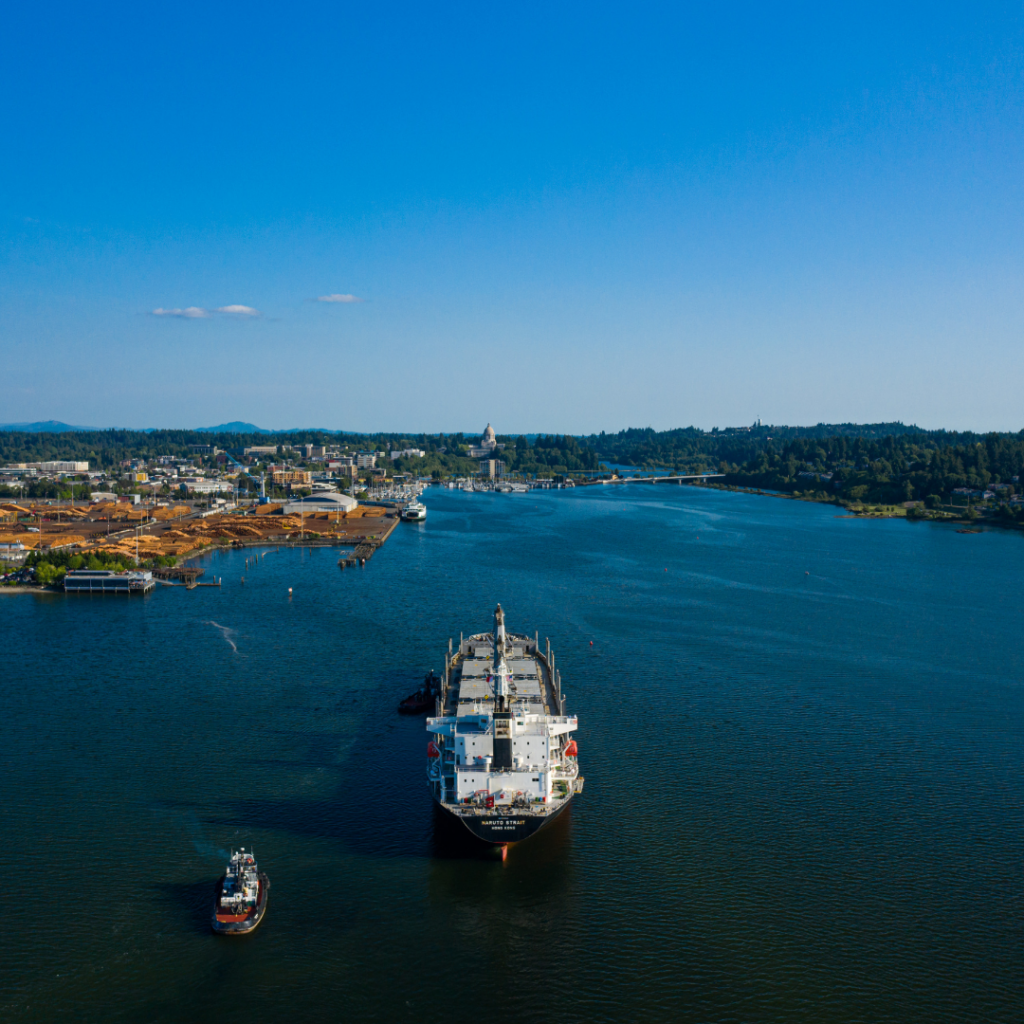 One large and one small vessel in Budd Inlet waters on sunny day