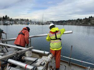 Two crew members on research boat