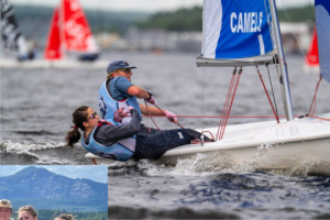 Two crew members leaning backwards to steer sailboat